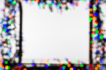 Frame made of Christmas blur colorful light on the background white color