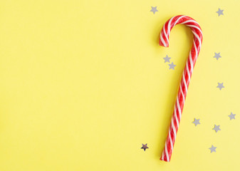 Christmas composition with garland, stars on green background. Flat lay, copy space.