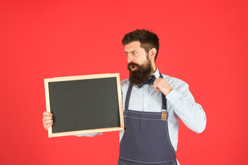 cafe shop advertisement. Happy hours. bearded man chalkboard, copy space. brutal waiter in kitchen. mature man red background. surprised hipster bartender. What to cook. Restaurant menu. Own business
