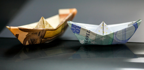 Paper boat made with Euro bills.