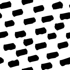 Spotted seamless pattern, hand-drawn. brush strokes black and white, diagonal.