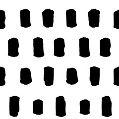 Spotted seamless pattern, hand-drawn. brush strokes black and white, vertical