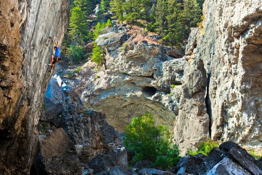 Aman climbs some beatiful limsetone on Monsters of the Deep (5.13c) at Natural Bridges State Park.