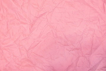 pink crumpled background with fabric texture