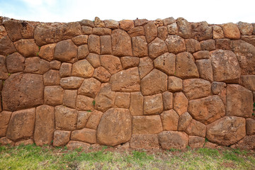 A stone wall in the Inca ruins. Chinchero, Peru.
