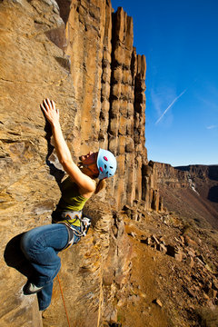 A woman leads an arete climb at Vantage in Central Washington.