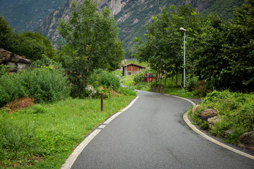 a country road approaching Hone town, Aosta Valley, Italy