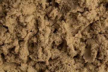 yellow kinetic baby sand close up.