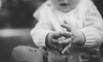 small newborn kid hands black and white