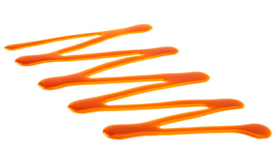 Sweet caramel sauce isolated on a white background