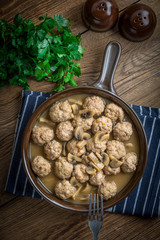 Delicious homemade swedish meatballs with mushroom cream sauce. Small depth of field. Top view.