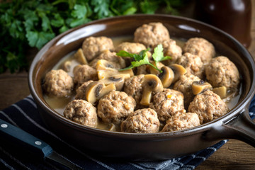 Delicious homemade swedish meatballs with mushroom cream sauce. Small depth of field.