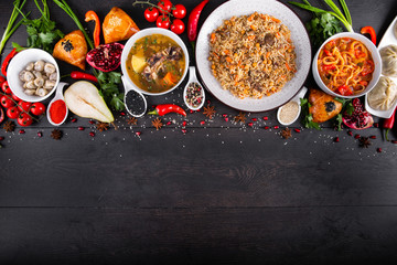 The concept of Eastern asian festive cuisine. Assorted Uzbek food set, pilaf, samsa, lagman, manta, shurpa restaurant concept, Uzbek food. Homemade Eastern arabic new year and Christmas dish from lamb