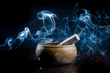 Tibetan bowl with incense smoke