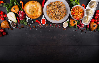 The concept of Eastern asian festive cuisine. Assorted Uzbek food set, pilaf, samsa, lagman, manta, shurpa restaurant concept, Uzbek food. Homemade Eastern arabic new year and Christmas dish from lamb