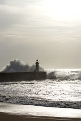 lighthouse with rough waves as background