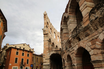 The picture from the center of the ancient city of Verona in Italy. The old historic houses and the famous Arena. 