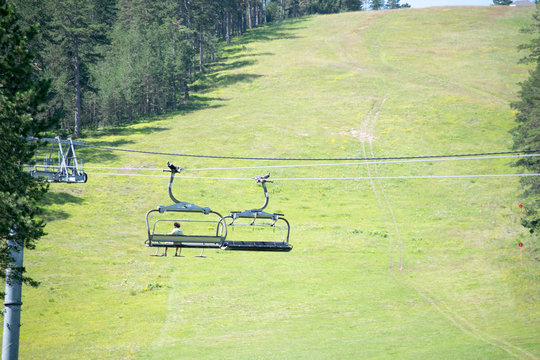 summer mountain landscape with ski lift in a ski base