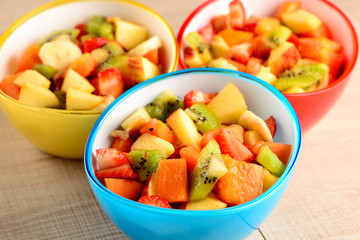 fruit salad in colorful bowls