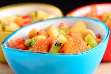 fruit salad in colorful bowls