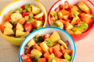 fruit salad in colorful bowls