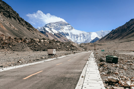 Photo of the asphalt road to the Everest base camp in Tibet China with summit peak in the background