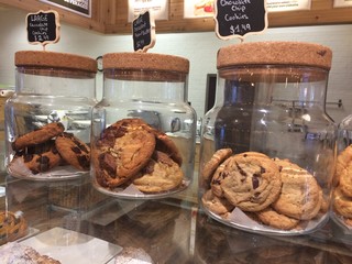 assortment of cookies in glass jars