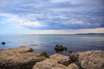 Fototapeta na wymiar Beautiful view on blue sea with Crimean bridge background.
