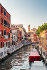 Venice, Italy. Ancient houses, moored boats along the canal