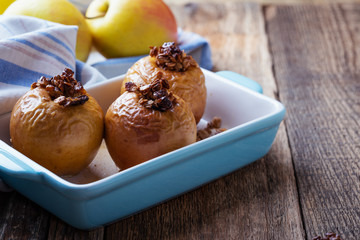 Vegan dessert, baked apples on rustic table