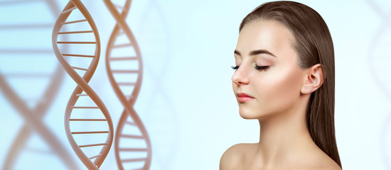 DNA stems and beautiful female face over light blue background.