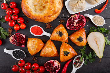 The concept of Eastern asian festive cuisine. Assorted Uzbek food set, pilaf, samsa, lagman, manta, shurpa restaurant concept, Uzbek food. Homemade Eastern arabic new year and Christmas dish from lamb