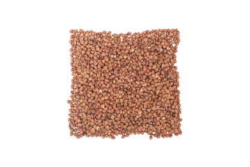 Heap of buckwheat groats isolated on white background.