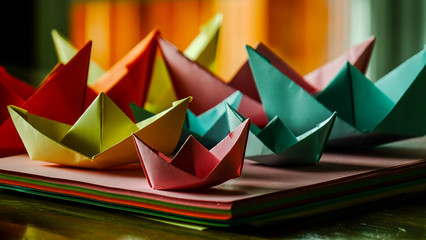 Paper boats red green yellow