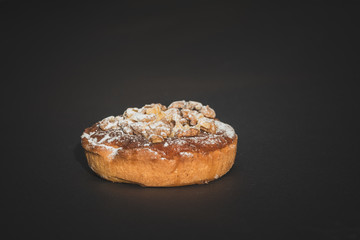 walnut cake on dark background