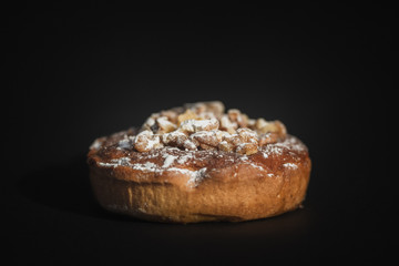walnut cake on dark background