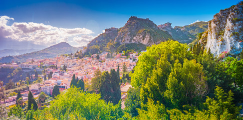 A panoramic view of Taormina, Giardini Naxos and Mount Etna, in Sicily, Italy. - obrazy, fototapety, plakaty