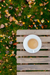 Cup with a coffee on table