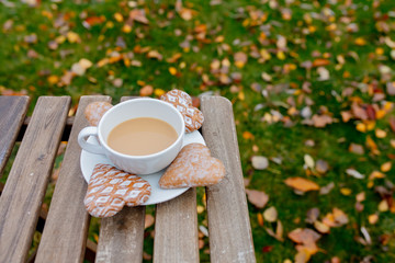 Cup of coffee with heart shape cookies on a table i