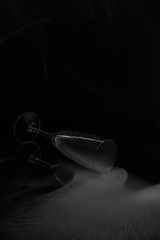 An empty glass glass filled with smoke on a dark background.