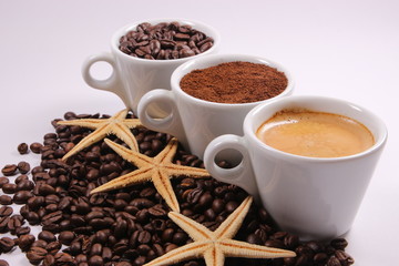 Three cups of coffee beans, powder and liquid - 304212089
