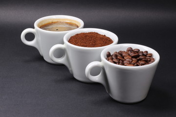 Three cups of coffee beans, powder and liquid - 304212235