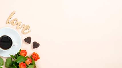Roses, coffee cup, heart shaped candy, wooden sign 
