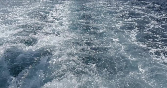 Ferryboat or Boat trace water foam behind the ship.