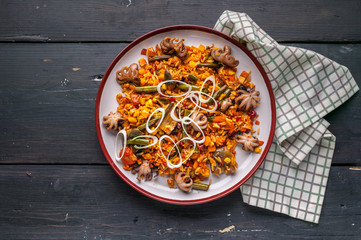 Traditional spanish paella with octopuses. Mediterranean food. Ketogenic Diet Recipes. Top view