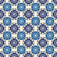 Ethnic, tribal wallpaper. Repeated segmented circles seamless pattern. Openwork ornament. Delicate ornamental background