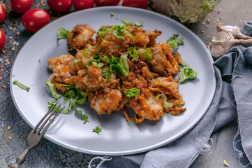 Vertical shot stewed cod with brussels sprouts in tomato sauce. Healthy seafood. Ketogenic diet