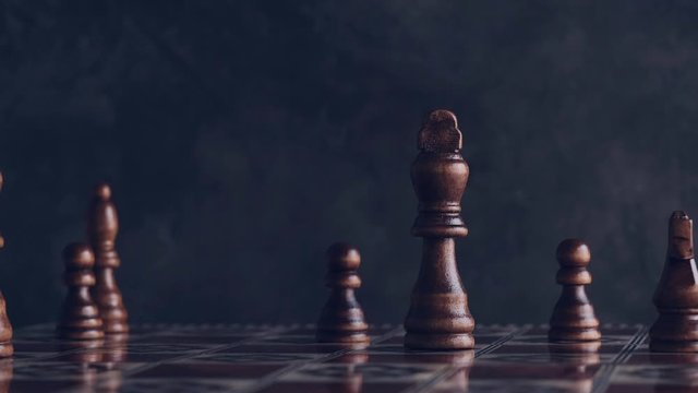 Wise person moving chess piece to win a game