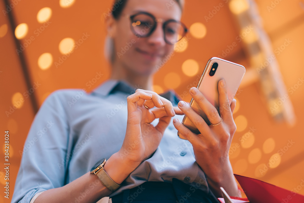 Aufkleber millennial girl sending text message via smartphone chatting online with friend via new application,