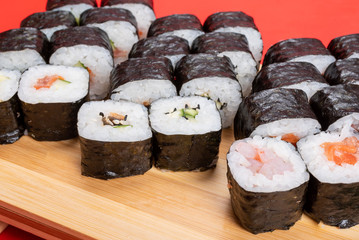Set of poppies with various fillings. With ginger and wasabi. Close-up.